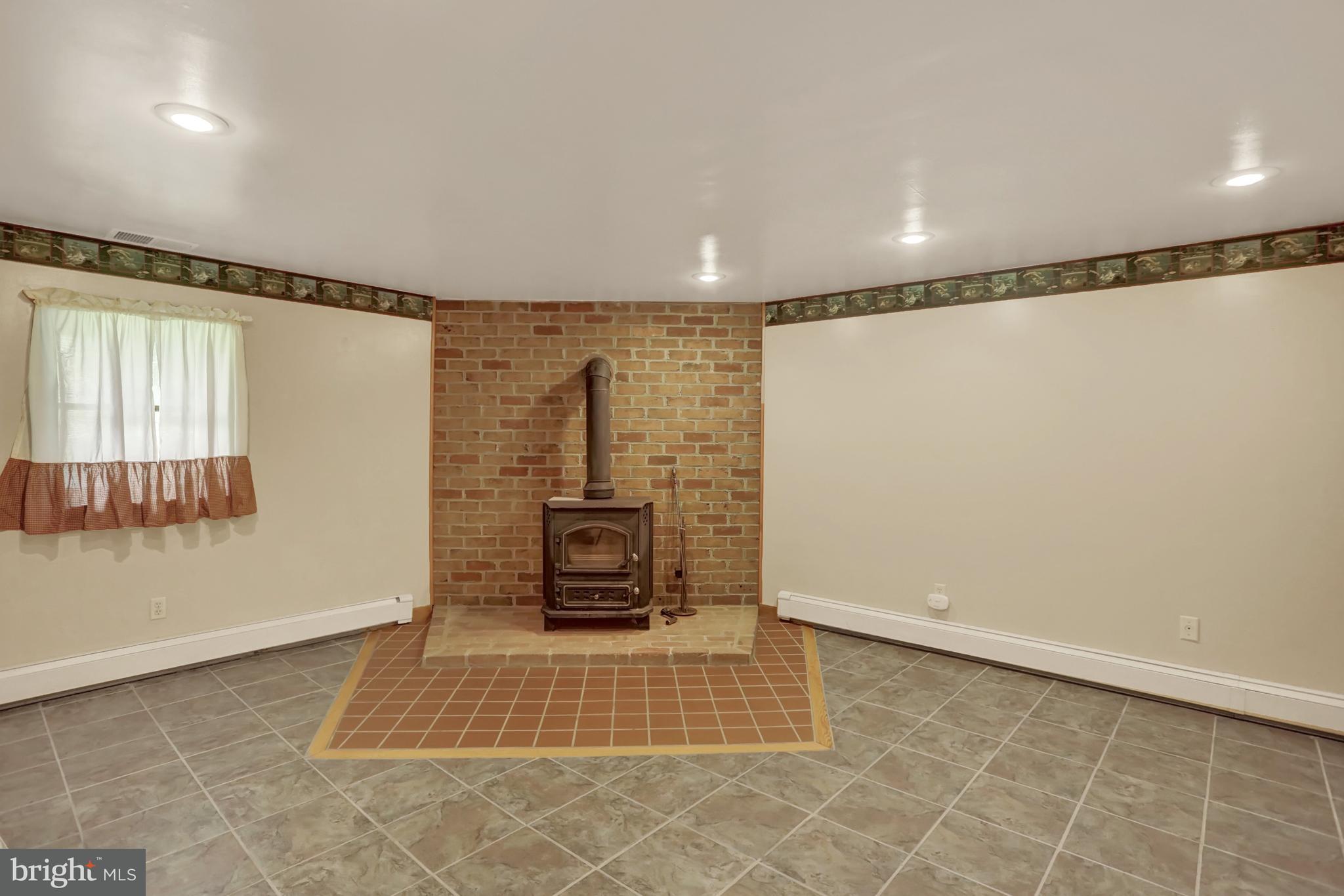21 Graham Road Newville, PA 17241 - Photo 31 of 55 Lower level Bedroom with coal stove