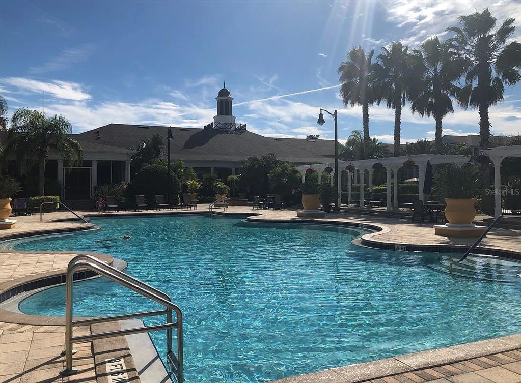 3725 Conroy Road, Unit 2135 Orlando, FL 32839 - Photo 13 of 14 a swimming pool with outdoor seating and yard