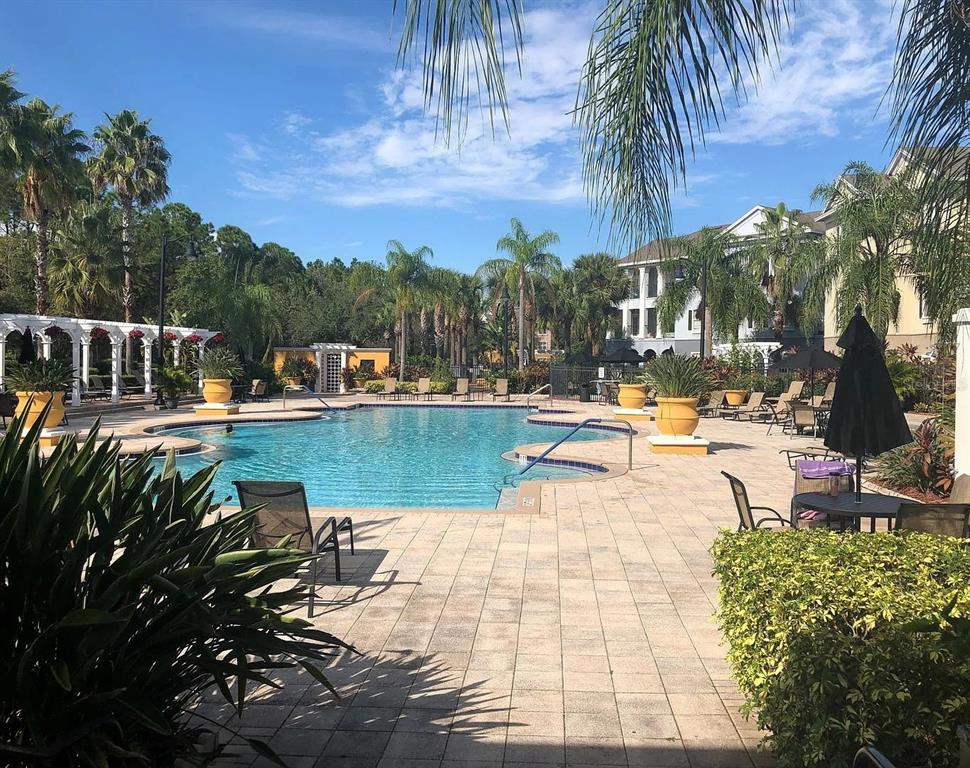 3725 Conroy Road, Unit 2135 Orlando, FL 32839 - Photo 14 of 14 a view of a swimming pool with a patio