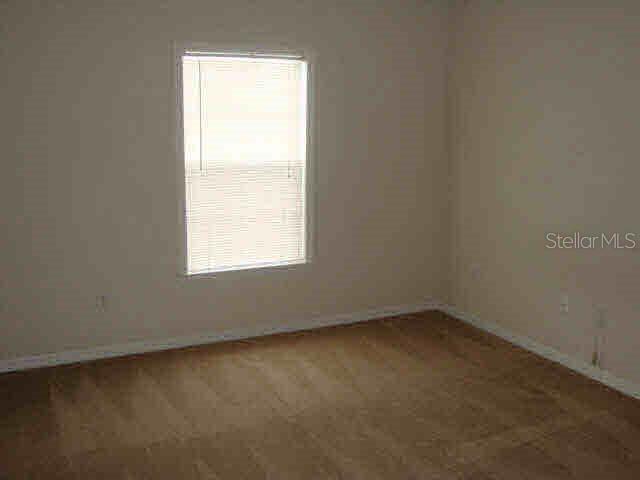 3725 Conroy Road, Unit 2135 Orlando, FL 32839 - Photo 8 of 14 an empty room with a window