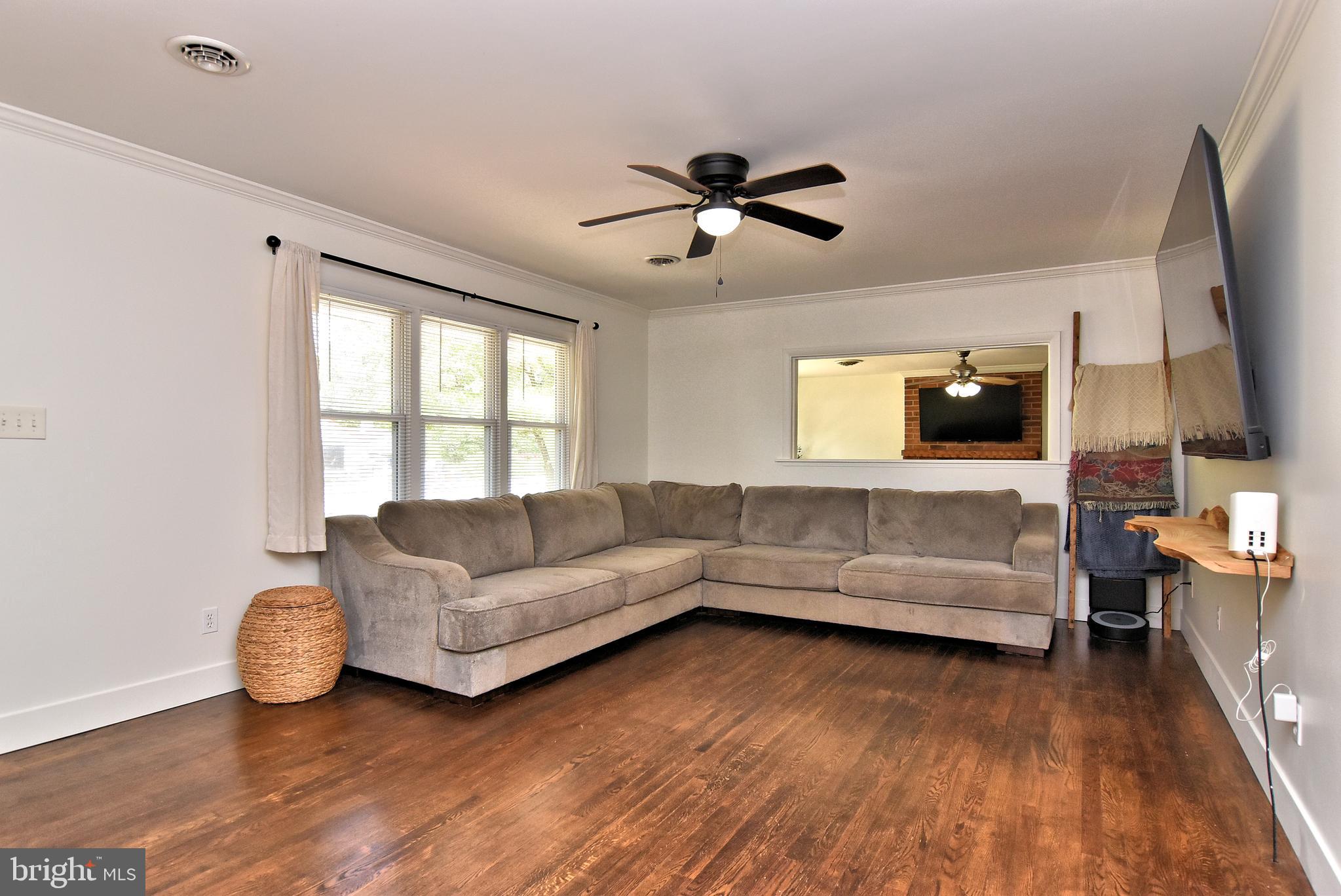 9012 Concord Road Seaford, DE 19973 - Photo 9 of 24 a living room with furniture and a flat screen tv