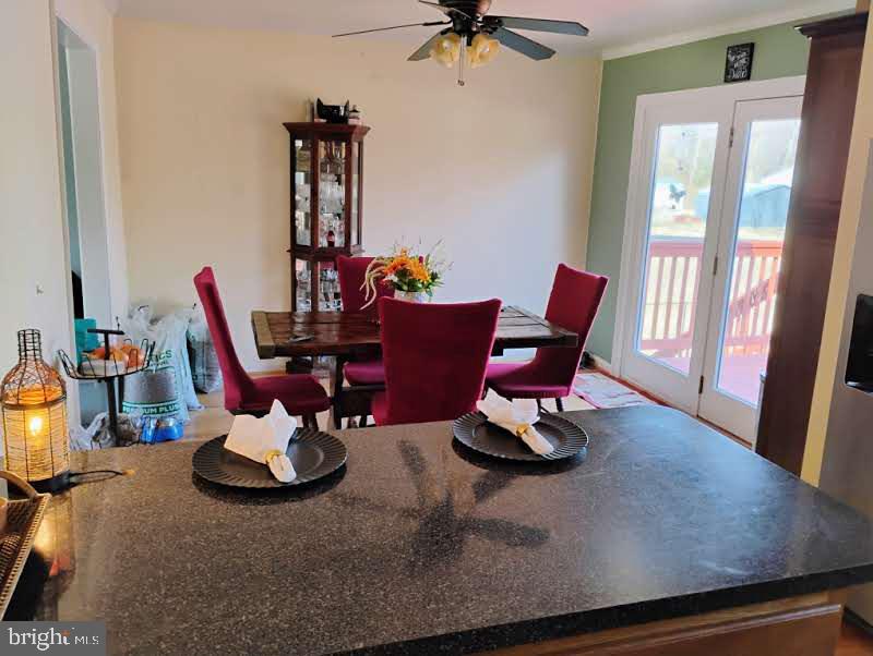 7881 Elizabeth Road Pasadena, MD 21122 - Photo 8 of 41 Dining room with french doors to large deck
