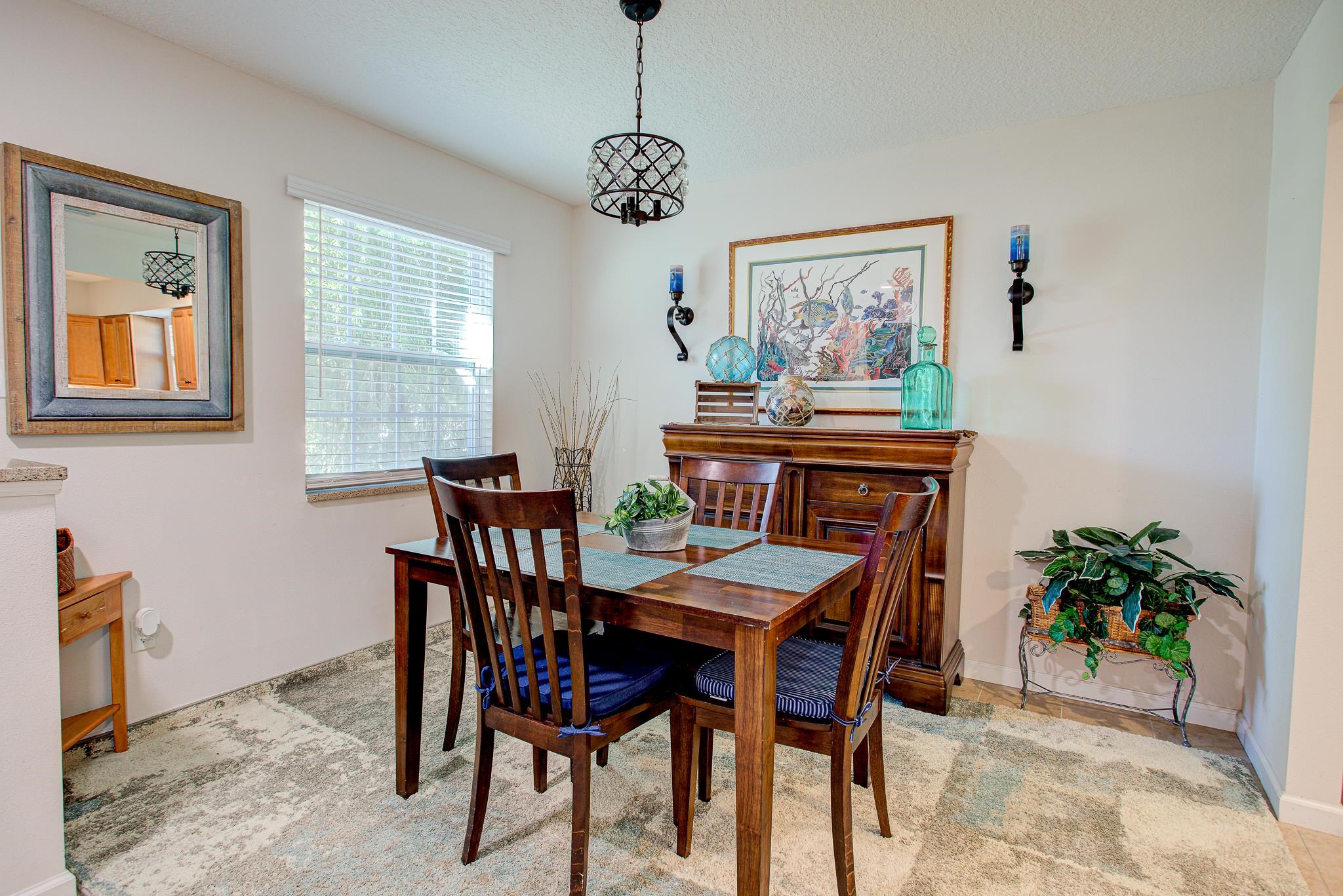 292 North Twin Maple Road St. Augustine, FL 32084 - Photo 23 of 79 a view of a dining room with furniture window and wooden floor