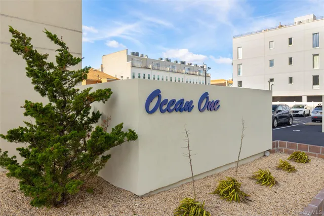 a view of a street with a building in the background