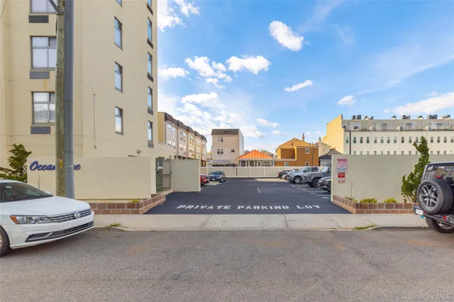 a view of a dining room with furniture and a chandelier