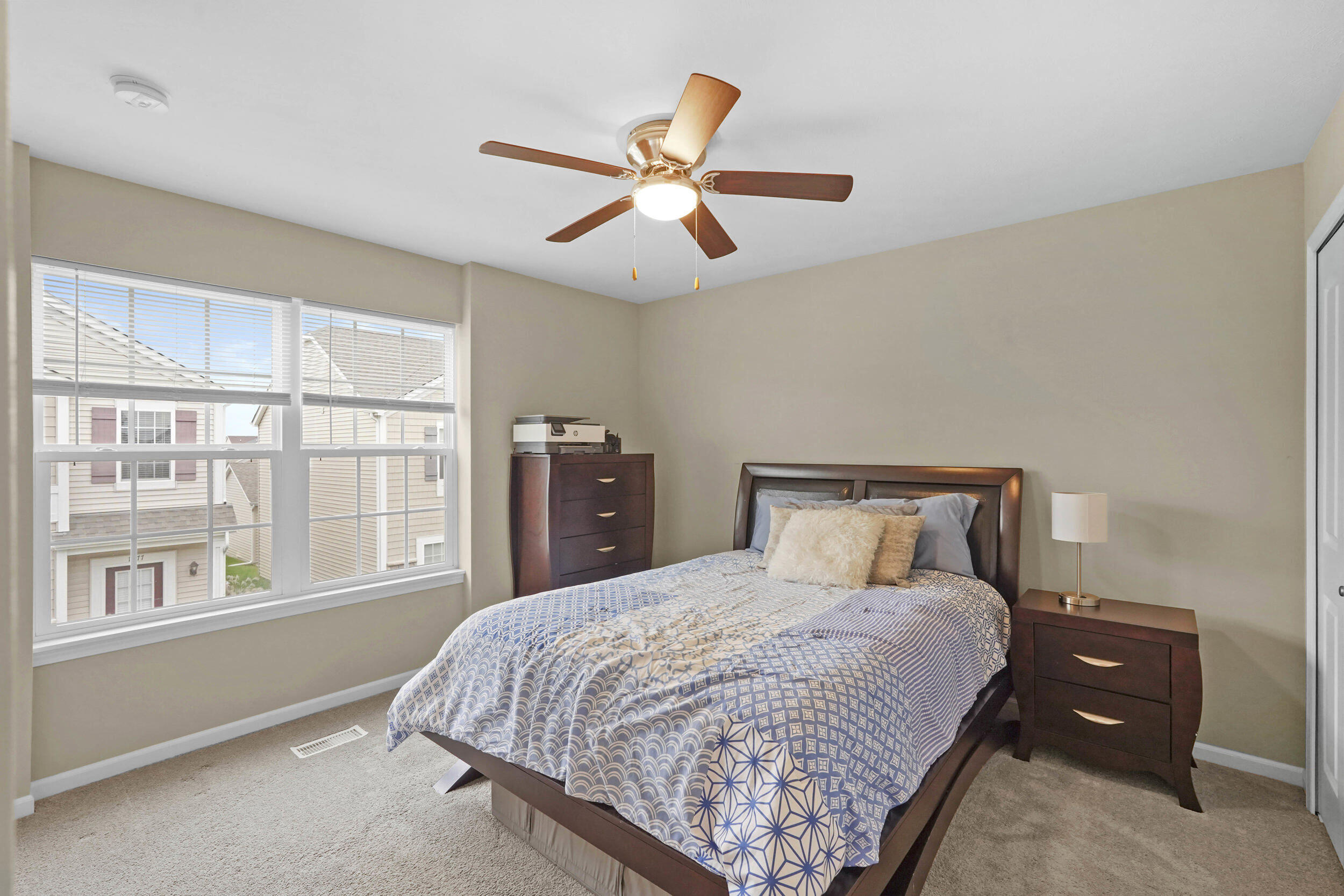 1066 East 115th Court Crown Point, IN 46307 - Photo 17 of 21 a bedroom with a large bed and a large window