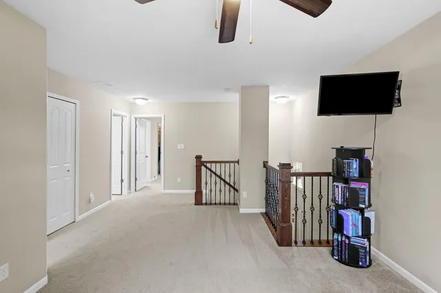 a view of a livingroom with furniture and windows