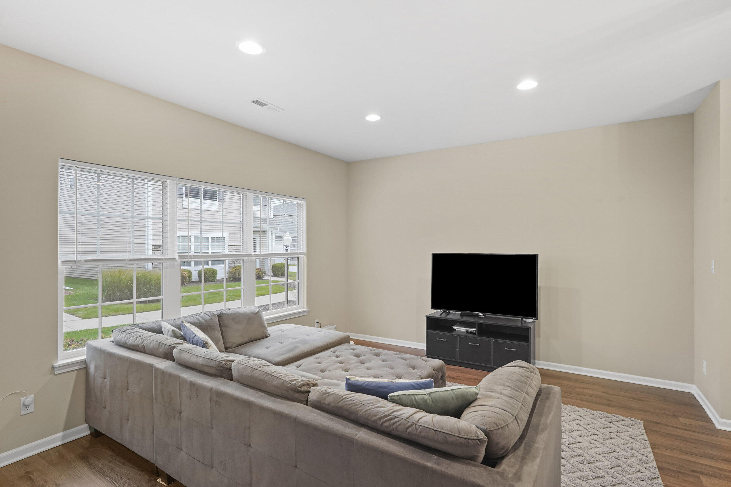 1066 East 115th Court Crown Point, IN 46307 - Photo 5 of 21 a living room with furniture and a flat screen tv
