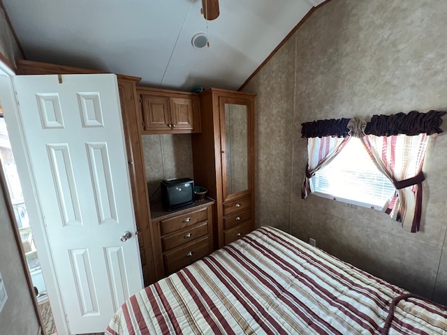 2795 East 28th Road Marseilles, IL 61341 - Photo 14 of 60 a bedroom with a bed and a flat tv screen on the dresser