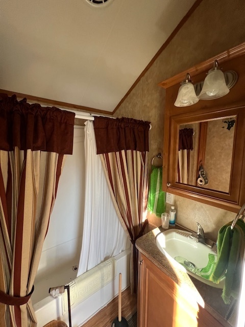 2795 East 28th Road Marseilles, IL 61341 - Photo 16 of 60 a bathroom with a sink a mirror and bathtub