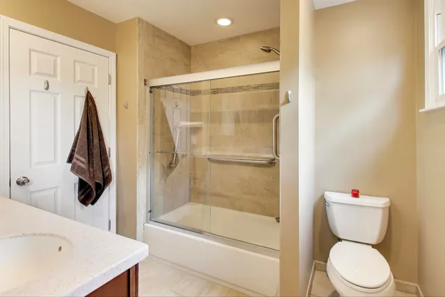 a bathroom with a bathtub and a toilet