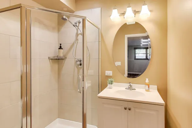 a bathroom with a sink and mirror