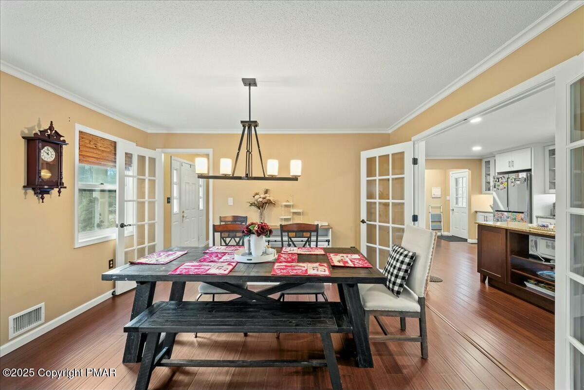 1295 Scotrun Drive Scotrun, PA 18355 - Photo 15 of 76 a view of a dining room with furniture window and wooden floor
