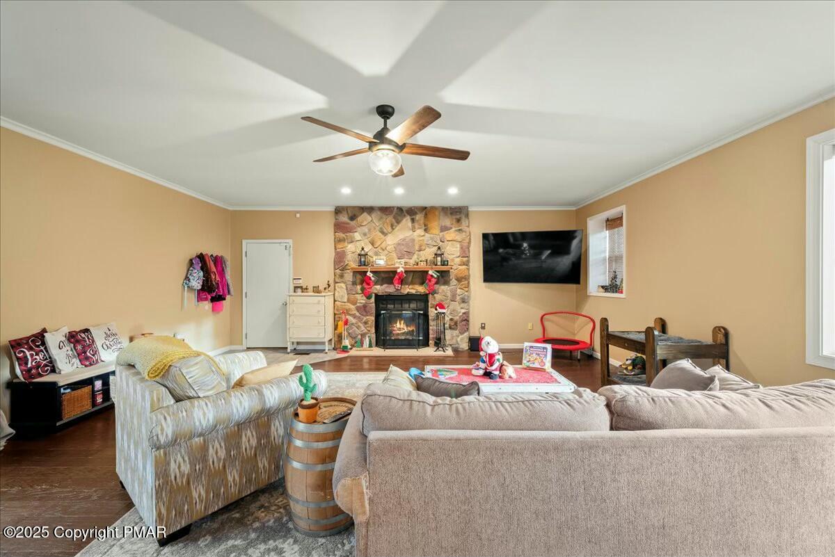 1295 Scotrun Drive Scotrun, PA 18355 - Photo 16 of 76 a living room with furniture and a flat screen tv