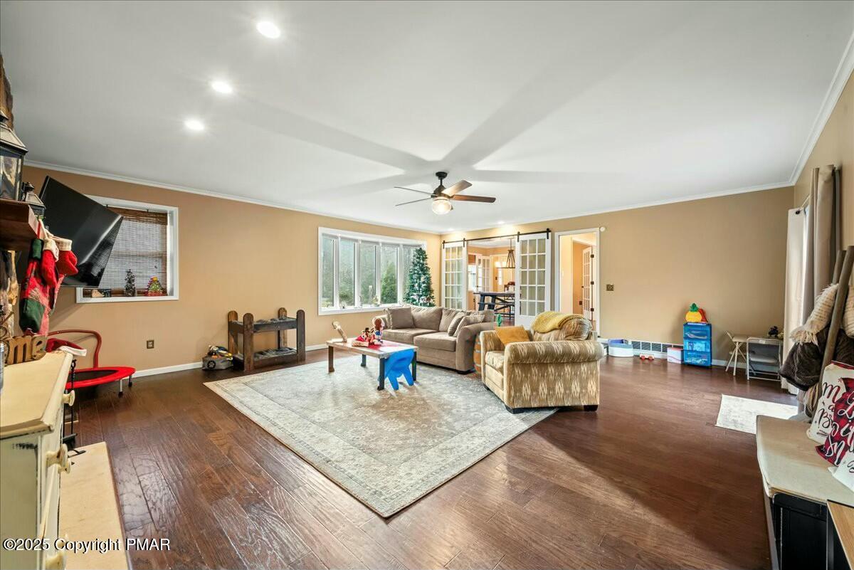 1295 Scotrun Drive Scotrun, PA 18355 - Photo 18 of 76 a living room with furniture and a flat screen tv
