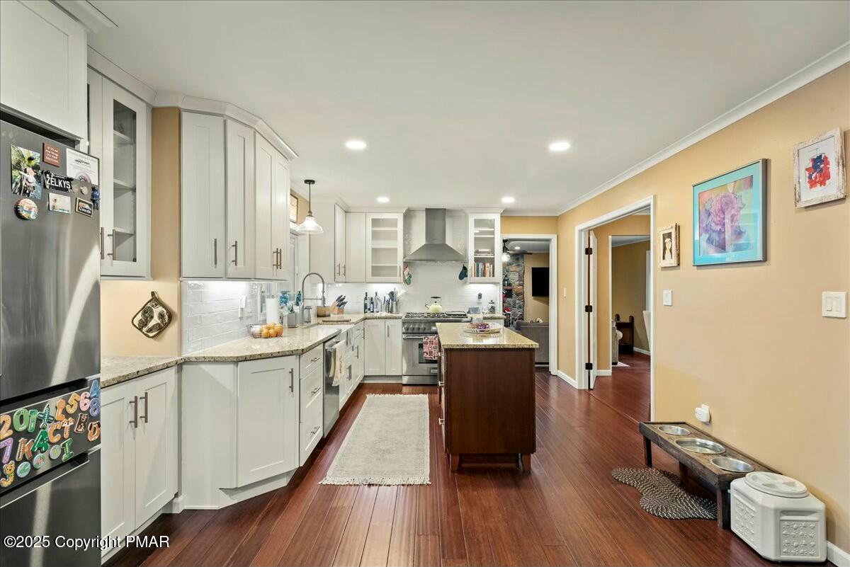 1295 Scotrun Drive Scotrun, PA 18355 - Photo 24 of 76 a kitchen with cabinets a sink and wooden floor