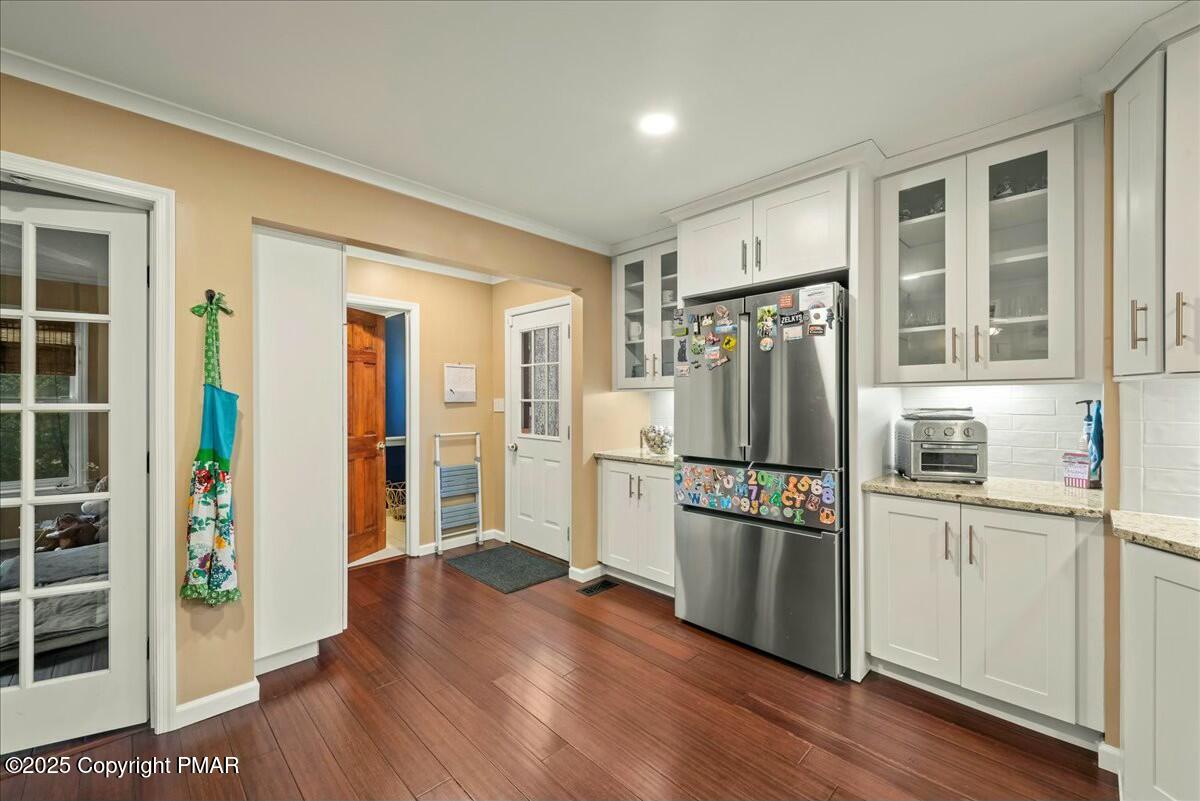 1295 Scotrun Drive Scotrun, PA 18355 - Photo 28 of 76 a kitchen with stainless steel appliances a refrigerator and wooden floor