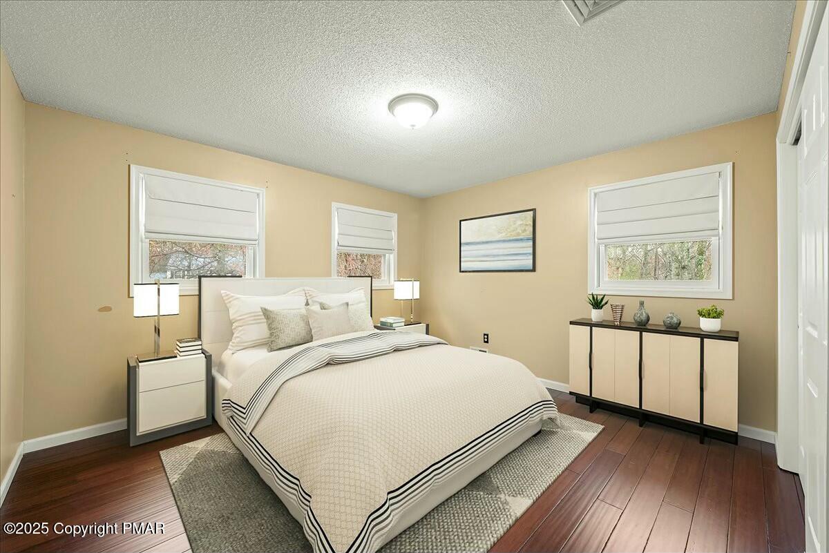 1295 Scotrun Drive Scotrun, PA 18355 - Photo 35 of 76 a bedroom with a bed and a large window