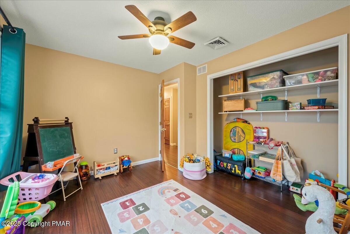 1295 Scotrun Drive Scotrun, PA 18355 - Photo 39 of 76 a bedroom with toys and a wooden floor