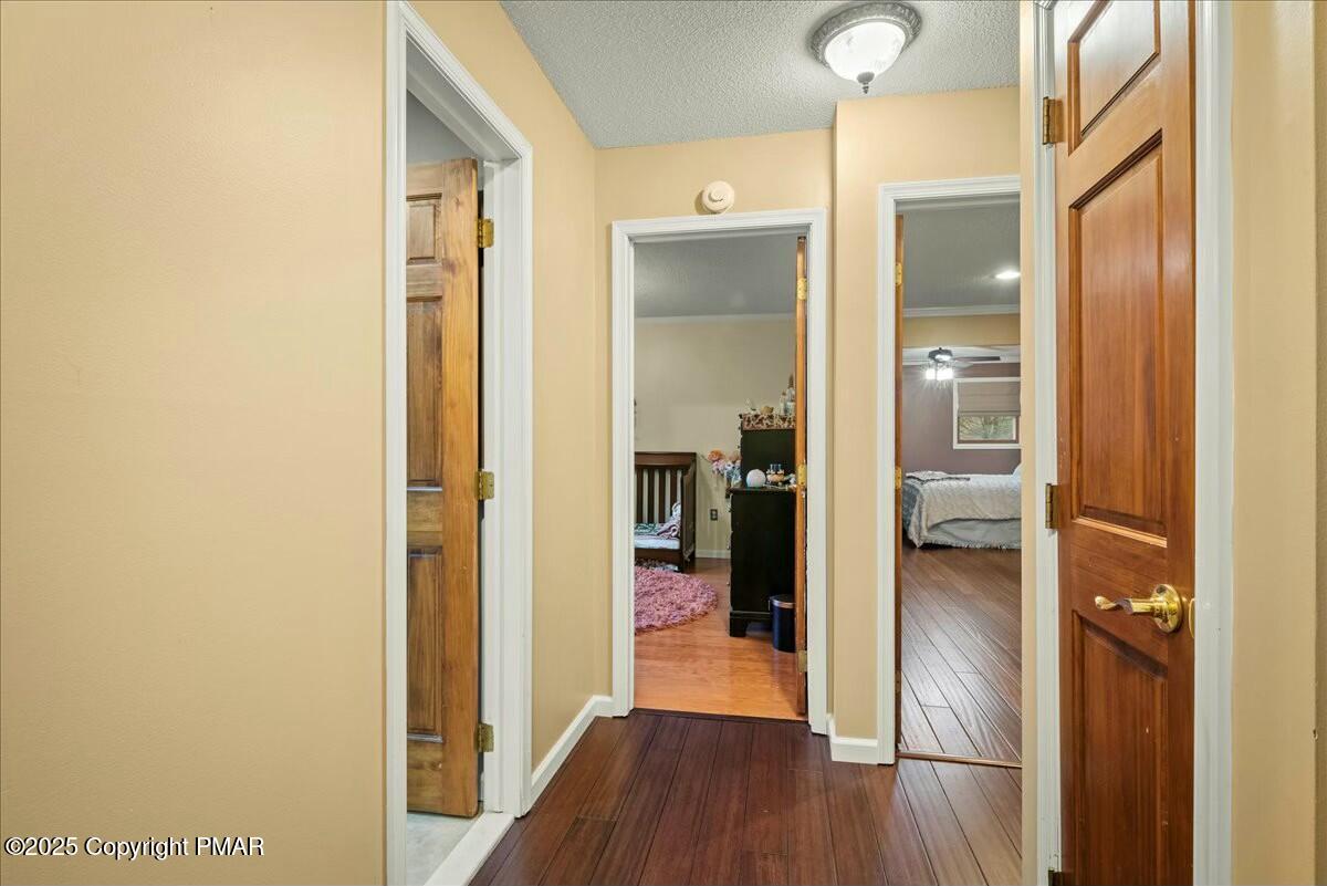 1295 Scotrun Drive Scotrun, PA 18355 - Photo 40 of 76 a view of a hallway with wooden floor