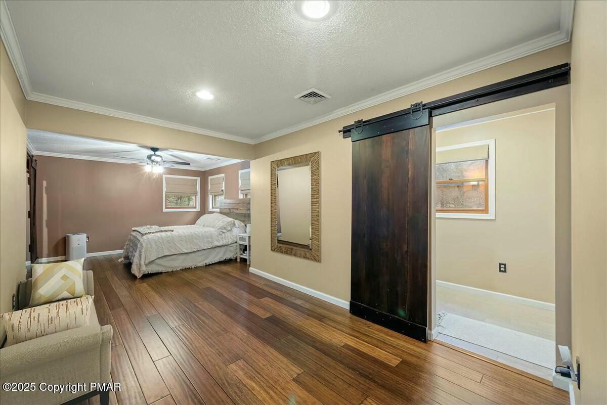 1295 Scotrun Drive Scotrun, PA 18355 - Photo 46 of 76 a bedroom with a bed and a walk in closet