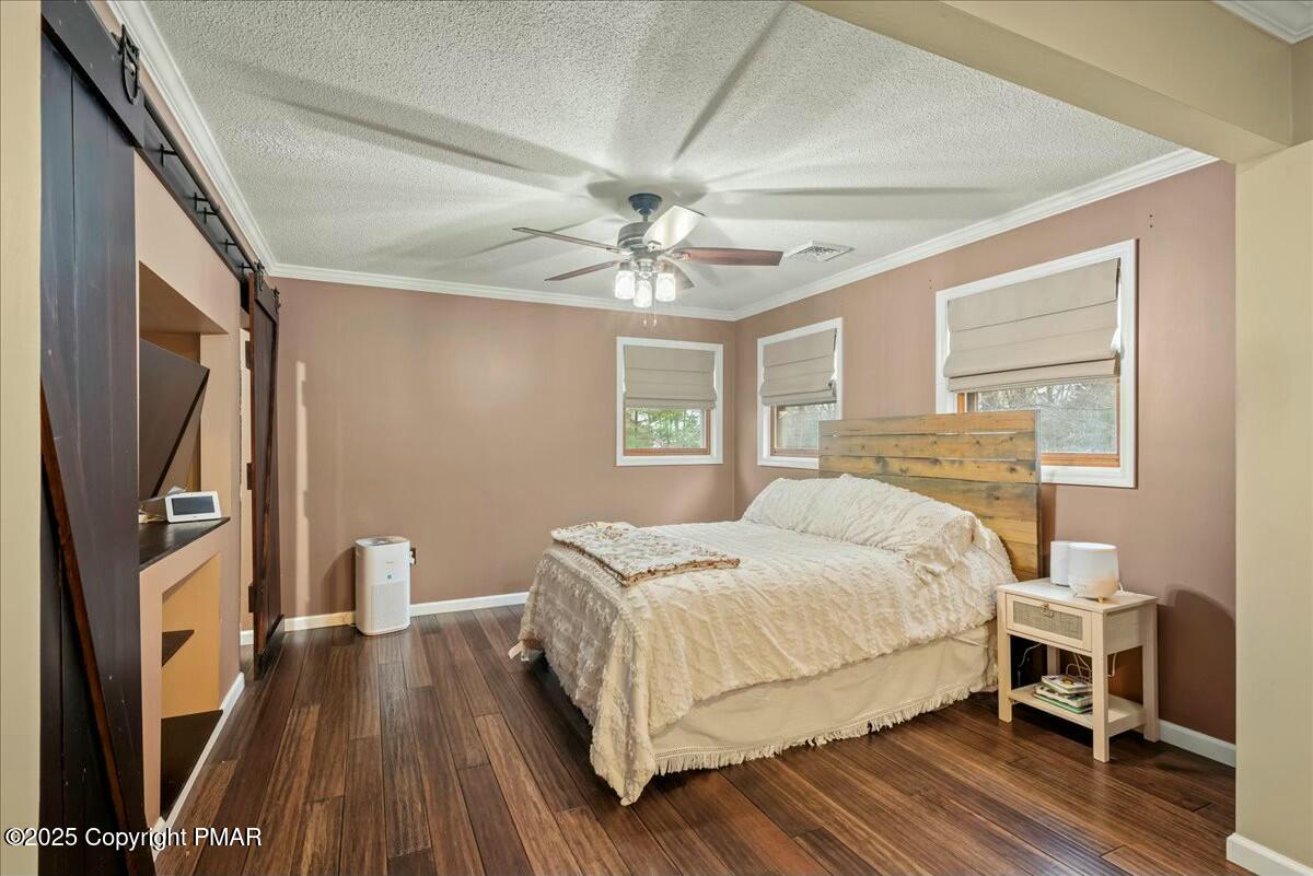 1295 Scotrun Drive Scotrun, PA 18355 - Photo 49 of 76 a bedroom with a bed and a flat screen tv