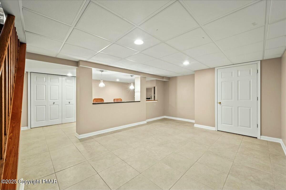 1295 Scotrun Drive Scotrun, PA 18355 - Photo 58 of 76 an empty room with a empty space and windows