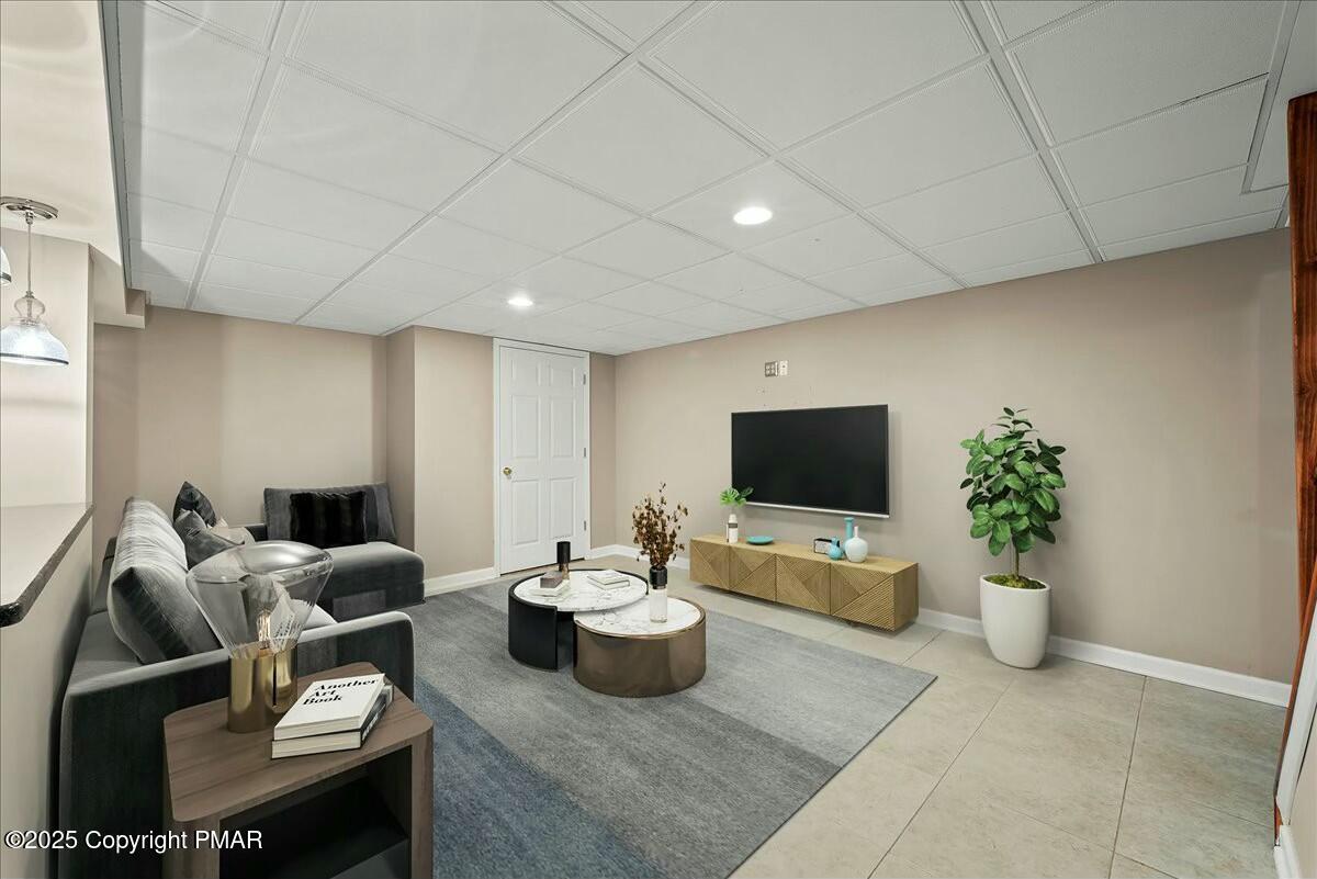 1295 Scotrun Drive Scotrun, PA 18355 - Photo 59 of 76 a living room with furniture and a flat screen tv