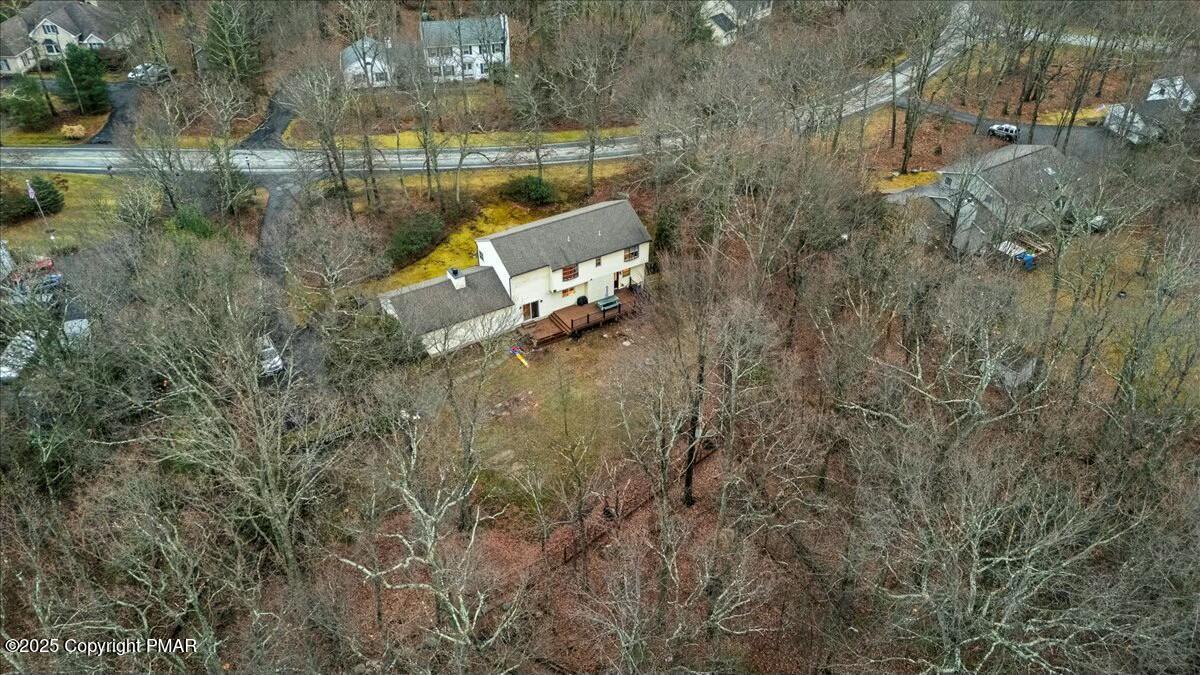 1295 Scotrun Drive Scotrun, PA 18355 - Photo 67 of 76 a aerial view of a house with a yard and lake view