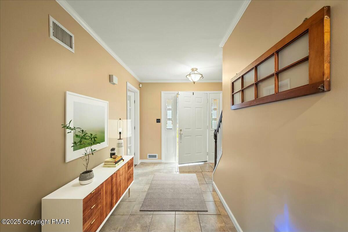 1295 Scotrun Drive Scotrun, PA 18355 - Photo 7 of 76 a hallway with a large window and couch