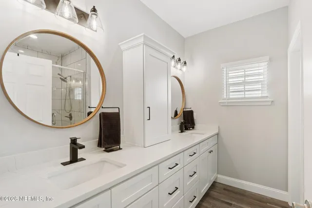 a bathroom with a bathtub and a shower