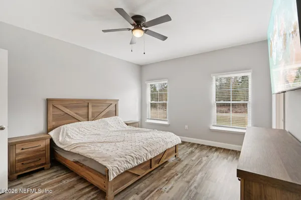 a view of walk in closet with clothes