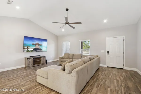 a living room with furniture and a window