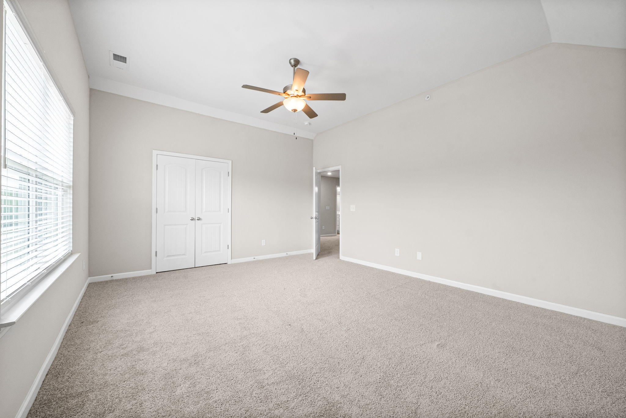 719 Reflections Lane Pleasant View, TN 37146 - Photo 27 of 46 an empty room with windows and fan