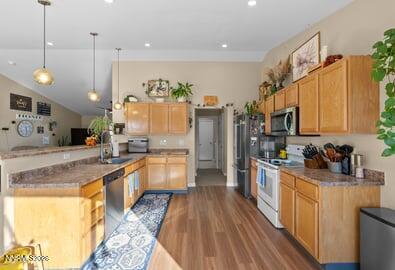552 Spur Court Fernley, NV 89408 - Photo 19 of 46 a large kitchen with lots of counter space and wooden floor