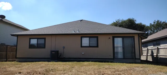 a house view with a backyard space