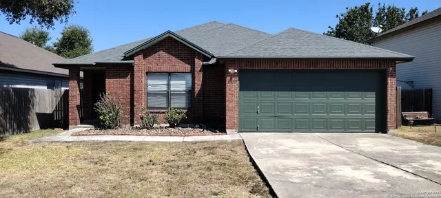 a view of house with outdoor space and parking space