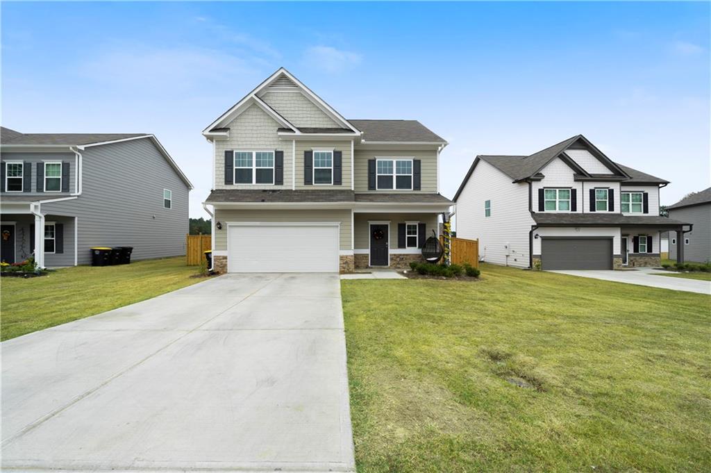 9 Maycroft Court Northeast Rome, GA 30161 - Photo 1 of 1 a front view of a house with a garden and yard