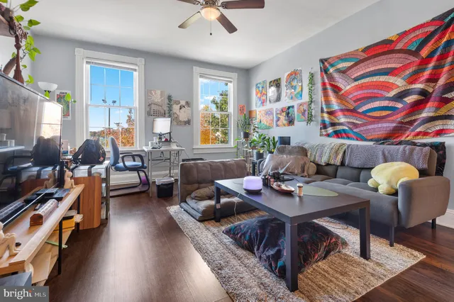 a work room with furniture and wooden floor