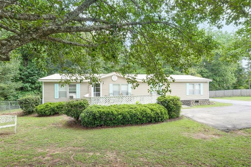 302 Hurst Mill Road Bremen, GA 30110 - Photo 1 of 1 a view of a house with a yard potted plants and a large tree