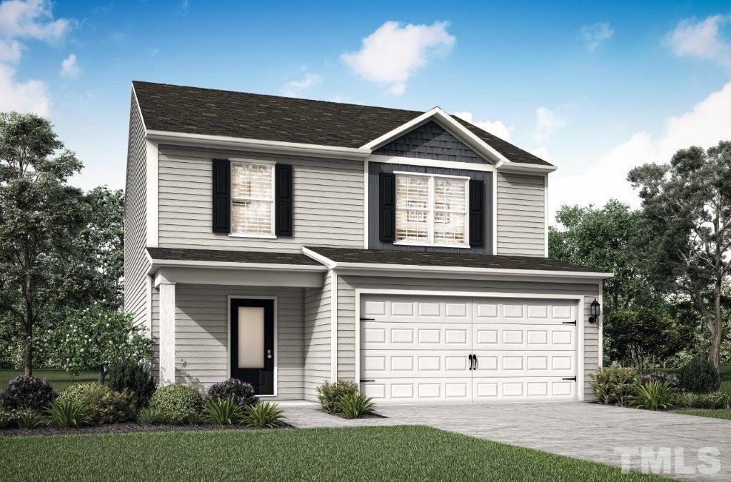 400 Crow Field Street Roxboro, NC 27574 - Photo 1 of 3 a front view of a house with a yard and garage