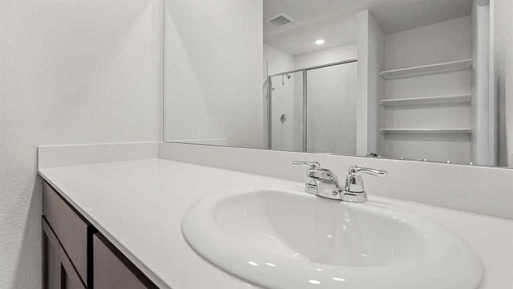 628 Dunham Road Farmersville, TX 75442 - Photo 35 of 36 White countertop with an integrated sink and chrome faucet