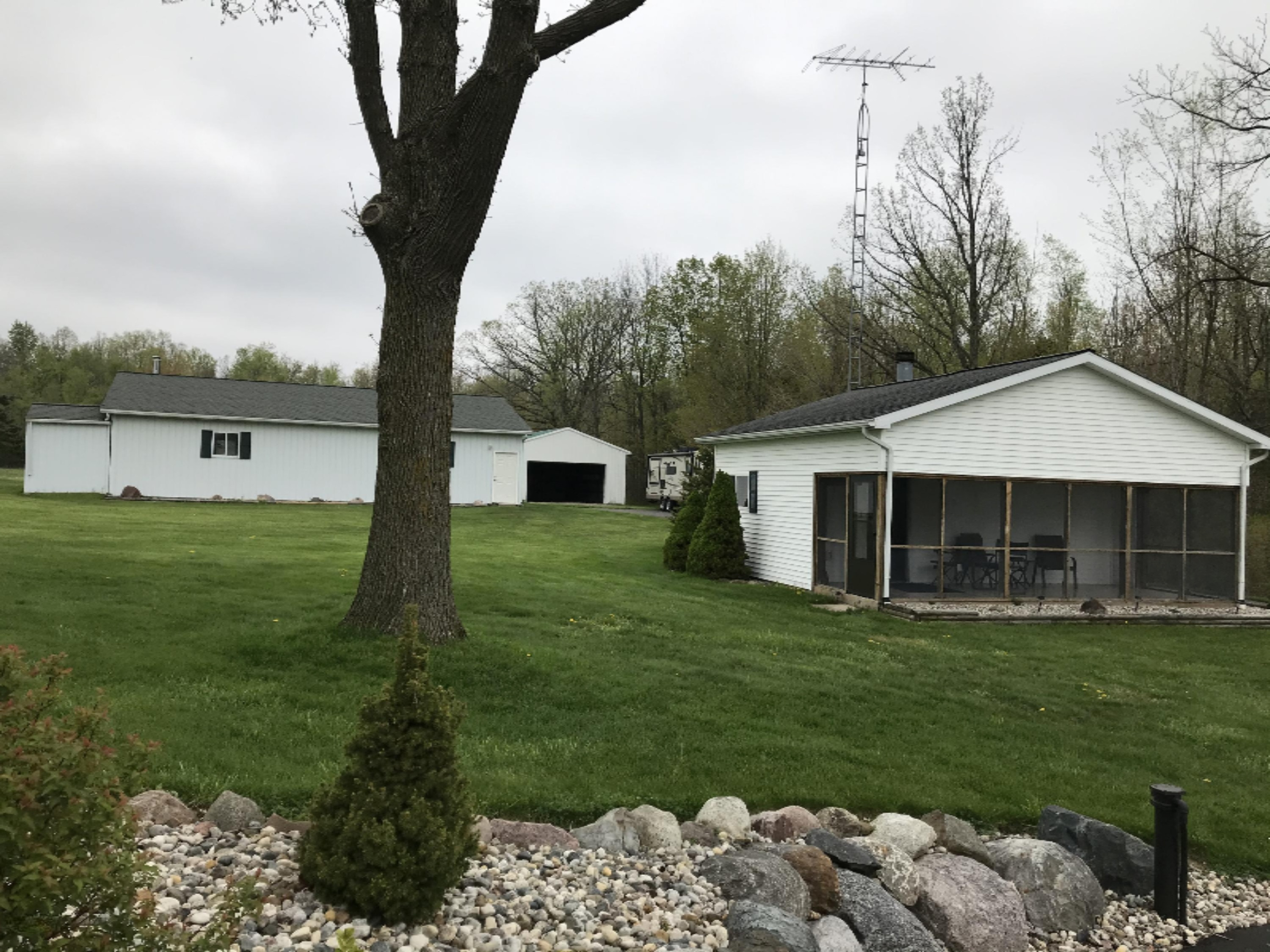 7460 Culbert Road Osseo, MI 49266 - Photo 46 of 67 Outbuilding #3 and Pole Barns behind