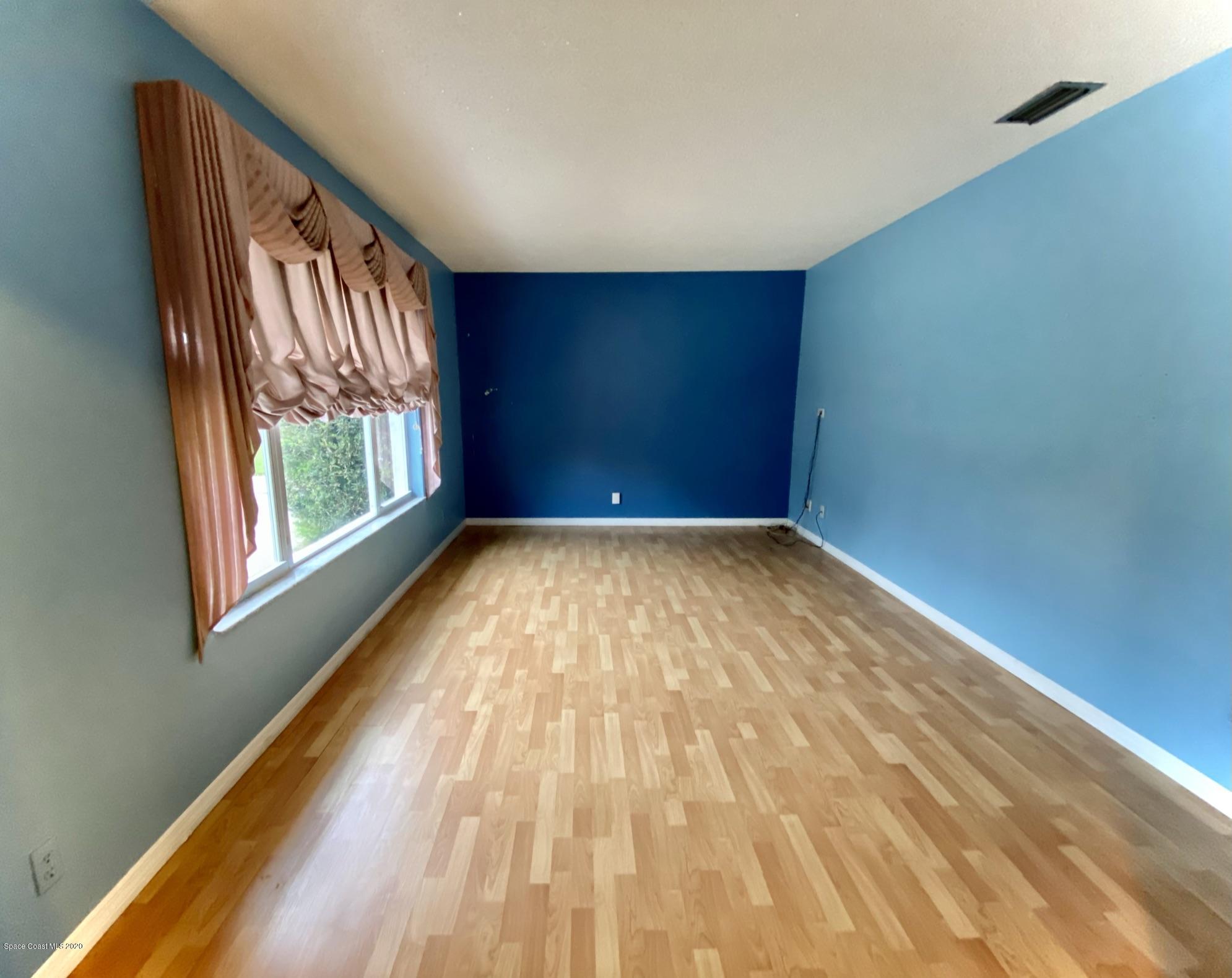 5282 Bridge Road Cocoa, FL 32927 - Photo 13 of 47 Laminate Flooring and Oversize Window