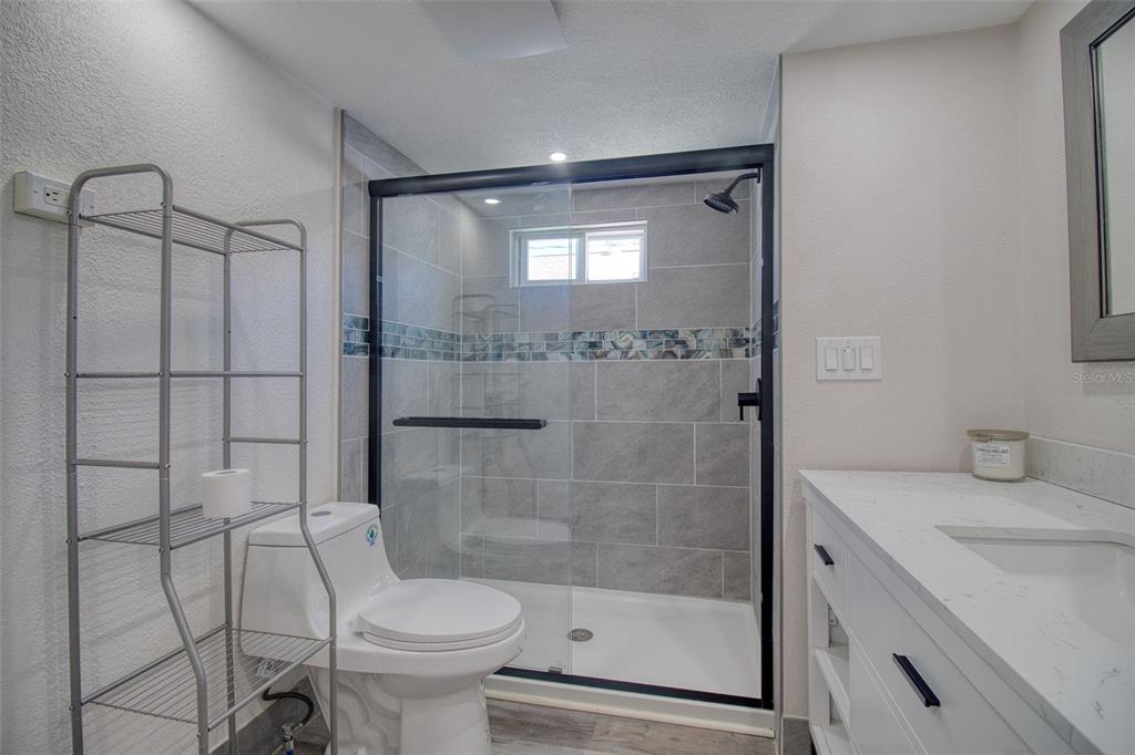 6820 Sea Ranch Drive Hudson, FL 34667 - Photo 14 of 29 a bathroom with a sink toilet and shower
