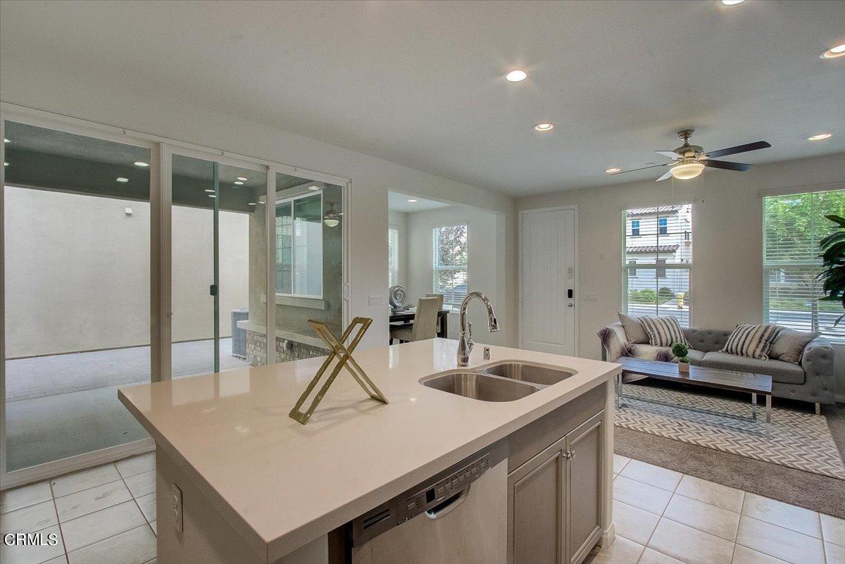 182 Stonegate Road Camarillo, CA 93010 - Photo 13 of 41 a kitchen with a sink a counter top space and living room view