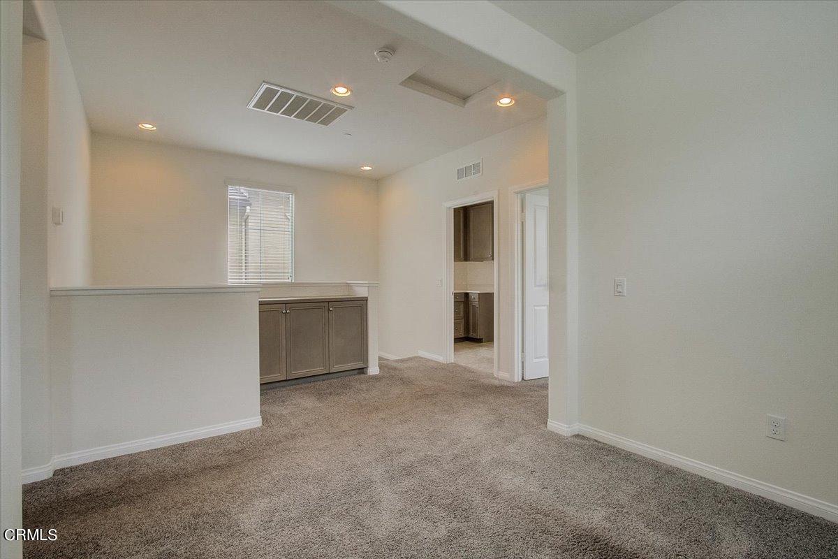 182 Stonegate Road Camarillo, CA 93010 - Photo 18 of 41 an empty room with a kitchen and a sink