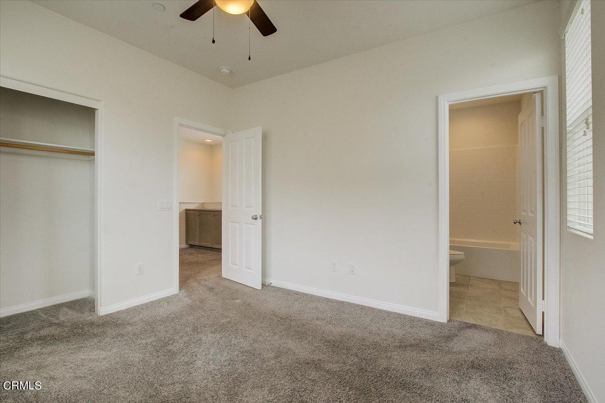 182 Stonegate Road Camarillo, CA 93010 - Photo 20 of 41 an empty room with ceiling fan and window