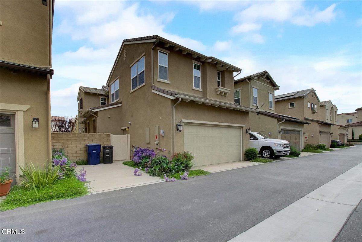 182 Stonegate Road Camarillo, CA 93010 - Photo 39 of 41 a front view of a house with a yard and garage