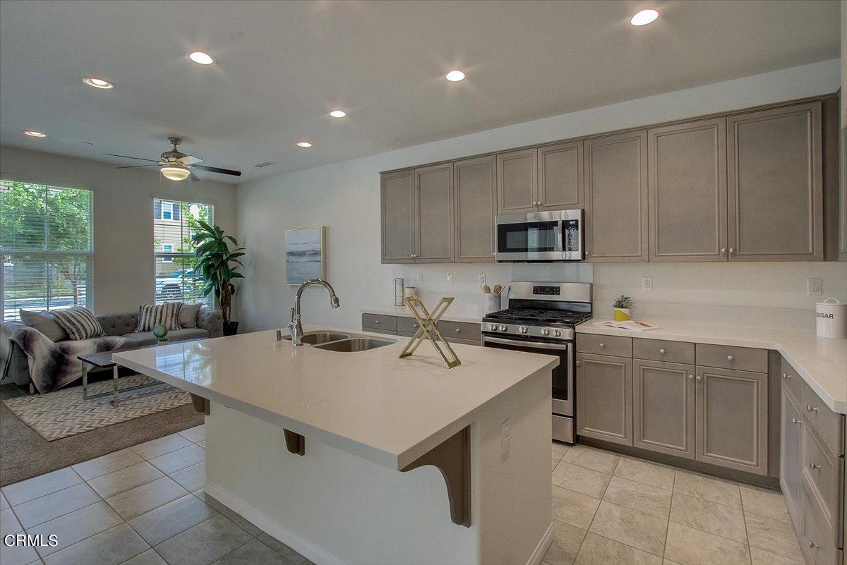 182 Stonegate Road Camarillo, CA 93010 - Photo 10 of 41 a kitchen with a sink stainless steel appliances and cabinets